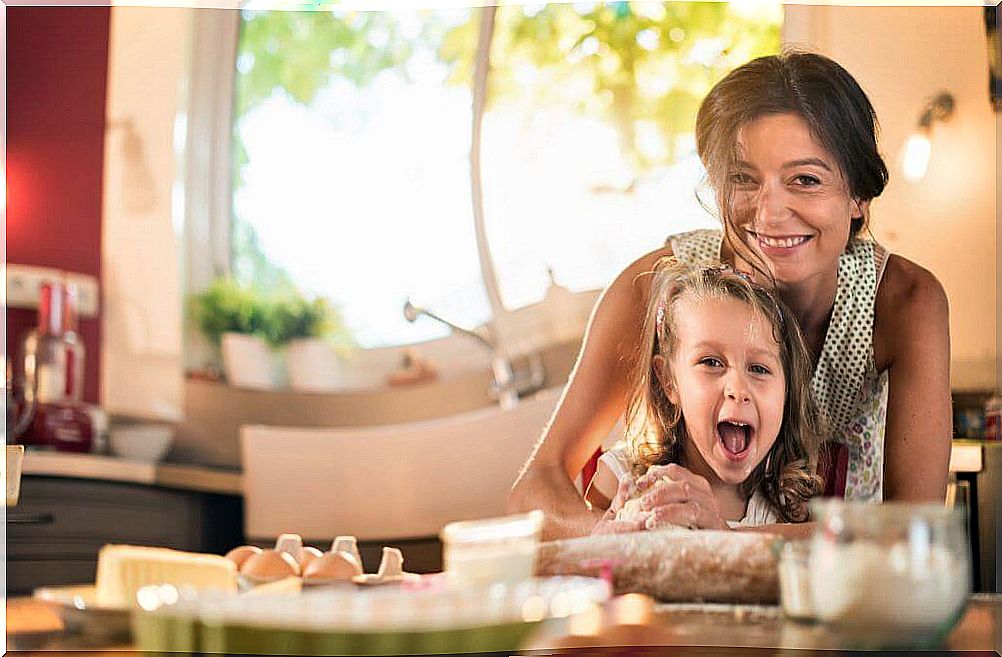 Mother and daughter cooking.