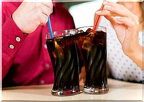 Two women having soft drinks