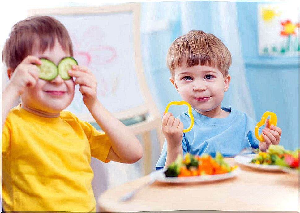 Children eating vegetables.