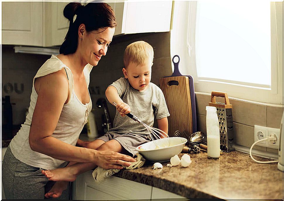 Mother and son cooking.