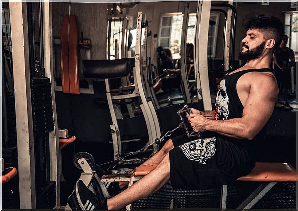 Man exercising in gym. 